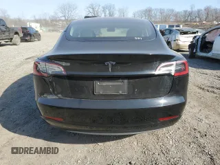 2023 Tesla Model 3 with VIN 5YJ3E1EA3PF670787, listed as a Copart auction lot 49070865 with 13,489 mi miles and Salvage title. Bid and sale history available at DreamBid. Image 6.