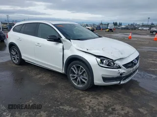 2016 Volvo V60 Cross Country T5 with VIN YV4612HKXG1013445, listed as a IAAI auction lot 41502674 with 113,657 mi miles. Bid and sale history available at carsss.com. Image 1.