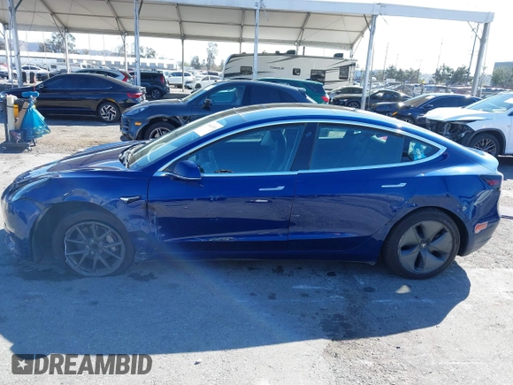 2019 Tesla Model 3 Mid Range with VIN 5YJ3E1EA8KF436086, listed as a IAAI auction lot 41682093 with 70,332 mi miles and . Bid and sale history available at DreamBid. Image 14.