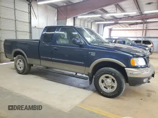 2002 Ford F-150 XL with VIN 1FTRX18L62NA69837, listed as a Copart auction lot 61581935 with 130,078 mi miles and Salvage title. Bid and sale history available at DreamBid. Image 4.