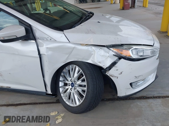 2018 Ford Focus Titanium z VIN 1FADP3N27JL314856, wystawiony jako IAAI lot #42553390 z przebiegiem 82 936 mil mil oraz . Historia ofert i sprzedaży dostępna na DreamBid. Obrazek 6.