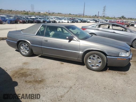1998 Cadillac Eldorado z VIN 1G6EL12YXWU610918, wystawiony jako Copart lot #57309075 z przebiegiem 168 228 mil mil oraz Szkoda całkowita • Salvage title. Historia ofert i sprzedaży dostępna na DreamBid. Obrazek 4.