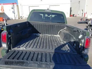 2021 Toyota Tacoma SR with VIN 3TYCZ5AN2MT039450, listed as a IAAI auction lot 40457613 with 54,176 mi miles and . Bid and sale history available at DreamBid. Image 16.
