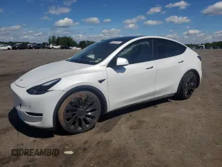 2022 Tesla Model Y Performance with VIN 7SAYGDEF9NF372337, listed as a Copart auction lot 55889345 with 51,099 mi miles and Salvage title. Bid and sale history available at DreamBid. Image 1.