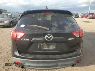 2014 Mazda CX-5 Touring with VIN JM3KE2CY9E0336218, listed as a Copart auction lot 49213255 with 124,749 mi miles and Salvage Title. Bid and sale history available at carsss.com. Image 6.