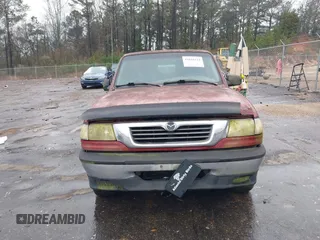 1998 Mazda B-Series 2WD Truck SE with VIN 4F4YR16C5WTM35045, listed as a IAAI auction lot 41655123 with 242,946 mi miles. Bid and sale history available at carsss.com. Image 6.