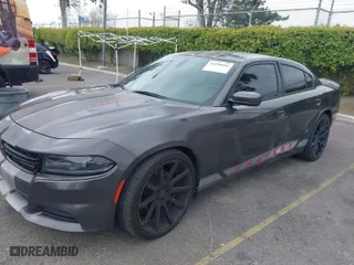 2019 Dodge Charger SXT with VIN 2C3CDXBG2KH643442, listed as a IAAI auction lot 41896681 with 104,061 mi miles. Bid and sale history available at carsss.com. Image 2.