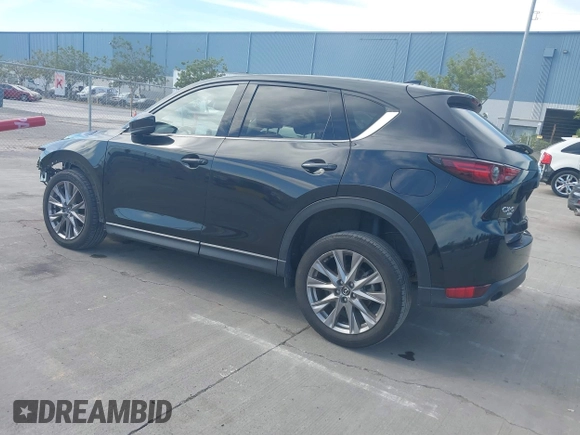 2021 Mazda CX-5 Grand Touring with VIN JM3KFBDM4M1426197, listed as a IAAI auction lot 42004644 with 43,814 mi miles. Bid and sale history available at carsss.com. Image 3.
