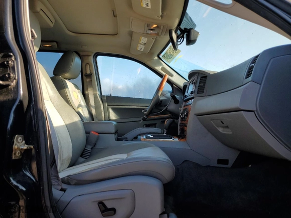 2006 Jeep Grand Cherokee Overland with VIN 1J8HR68256C334929, listed as a Copart auction lot 79450964 with 184,944 mi miles and Salvage Title. Bid and sale history available at carsss.com. Image 7.