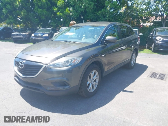 2015 Mazda CX-9 Touring z VIN JM3TB2CV1F0458995, wystawiony jako IAAI lot #42523344 z przebiegiem 130 763 mil mil oraz . Historia ofert i sprzedaży dostępna na DreamBid. Obrazek 2.