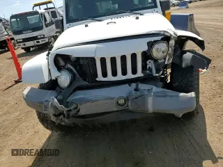 2014 Jeep Wrangler Unlimited Sahara with VIN 1C4BJWEG1EL210949, listed as a Copart auction lot 60977555 with 122,495 mi miles and Salvage title. Bid and sale history available at DreamBid. Image 14.