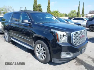 2015 GMC Yukon XL Denali with VIN 1GKS1JKJ1FR134428, listed as a IAAI auction lot 42149588 with 116,207 mi miles. Bid and sale history available at carsss.com. Image 1.