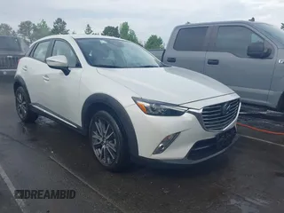 2018 Mazda CX-3 Grand Touring z VIN JM1DKFD74J0320607, wystawiony jako IAAI lot #42099441 z przebiegiem 128 368 mil mil oraz . Historia ofert i sprzedaży dostępna na DreamBid. Obrazek 1.