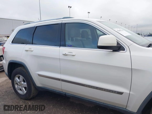 2012 Jeep Grand Cherokee Laredo with VIN 1C4RJFAG5CC224032, listed as a IAAI auction lot 42069334 with 106,614 mi miles. Bid and sale history available at carsss.com. Image 14.