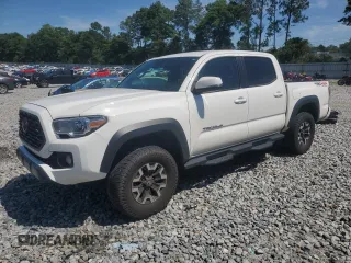 2020 Toyota Tacoma SR5 z VIN 3TYCZ5AN6LT003081, wystawiony jako Copart lot #57071105 z przebiegiem 106 634 mil mil oraz Szkoda całkowita • Salvage title. Historia ofert i sprzedaży dostępna na DreamBid. Obrazek 1.