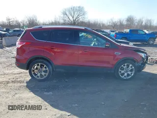2015 Ford Escape Titanium z VIN 1FMCU9J9XFUC75357, wystawiony jako IAAI lot #41705474 z przebiegiem 198 381 mil mil oraz . Historia ofert i sprzedaży dostępna na DreamBid. Obrazek 13.