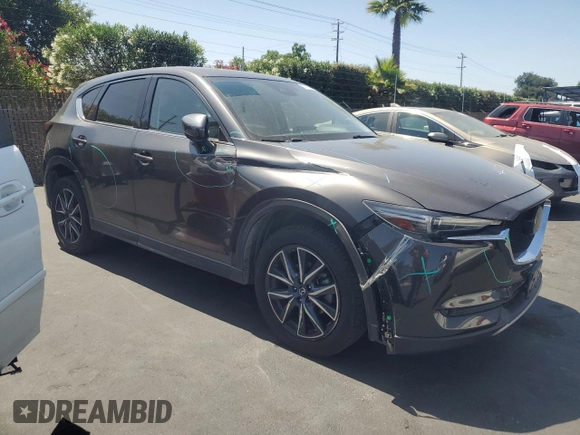 2018 Mazda CX-5 Grand Touring with VIN JM3KFADM3J1389911, listed as a Copart auction lot 60530295 with 103,177 mi miles and Salvage title. Bid and sale history available at DreamBid. Image 4.