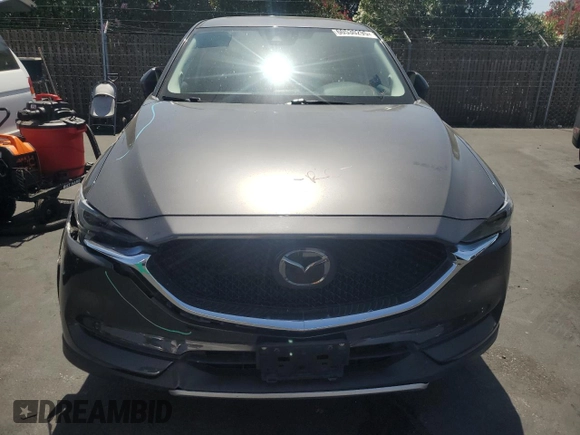 2018 Mazda CX-5 Grand Touring with VIN JM3KFADM3J1389911, listed as a Copart auction lot 60530295 with 103,177 mi miles and Salvage title. Bid and sale history available at DreamBid. Image 5.