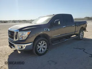 2017 Nissan Titan XD SV with VIN 1N6AA1F28HN551630, listed as a Copart auction lot 87104504 with 136,518 mi miles and Salvage Title. Bid and sale history available at carsss.com. Image 1.