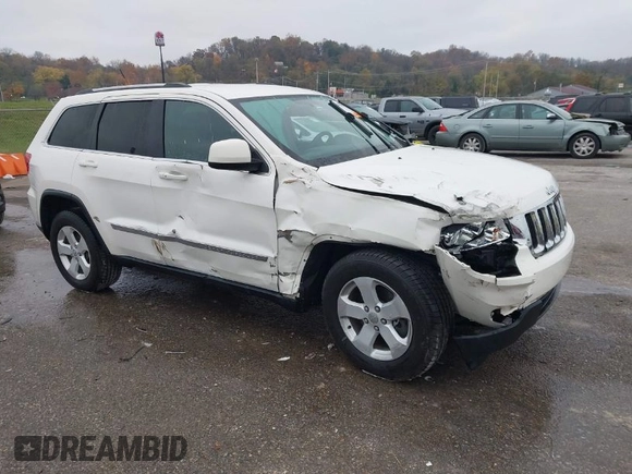 2012 Jeep Grand Cherokee Laredo with VIN 1C4RJFAG6CC297958, listed as a IAAI auction lot 40859811 with 213,499 mi miles. Bid and sale history available at carsss.com. Image 1.