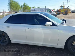 2012 Chrysler 300 SRT-8 with VIN 2C3CCAFJ9CH801749, listed as a IAAI auction lot 40912606 with 144,404 mi miles and . Bid and sale history available at DreamBid. Image 14.