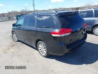 2012 Toyota Sienna XLE with VIN 5TDDK3DC1CS047105, listed as a IAAI auction lot 41901541 with 176,476 mi miles. Bid and sale history available at carsss.com. Image 3.