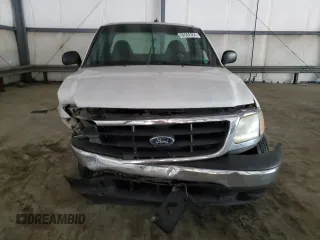 2000 Ford F-150 XL с VIN 1FTPF17L1YKA92061, выставлен на аукционе Copart как лот 66962304 с пробегом Не указан миль и Списание • Salvage title. История ставок и продаж доступна на DreamBid. Изображение 5.