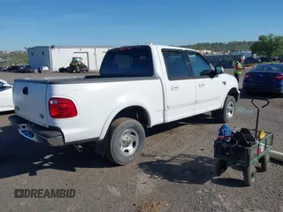 2003 Ford F-150 XLT with VIN 1FTRW08633KD11896, listed as a IAAI auction lot 42137360 with 118,654 mi miles. Bid and sale history available at carsss.com. Image 4.