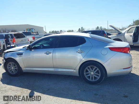 2013 Kia Optima LX z VIN KNAGM4A70D5414844, wystawiony jako IAAI lot #41774246 z przebiegiem 180 332 mil mil oraz . Historia ofert i sprzedaży dostępna na DreamBid. Obrazek 13.