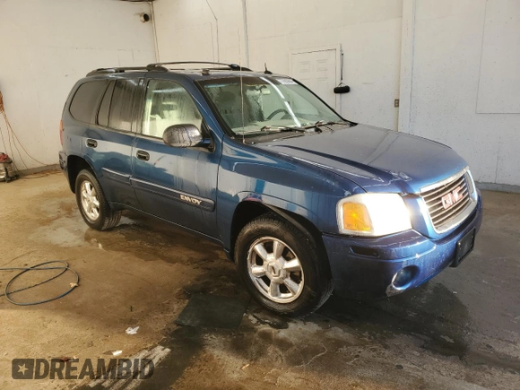 2005 GMC Envoy SLT with VIN 1GKDS13S652339845, listed as a Copart auction lot 77693684 with 220,306 mi miles and Salvage Title. Bid and sale history available at carsss.com. Image 4.