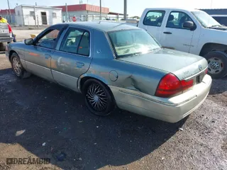 2005 Mercury Grand Marquis GS with VIN 2MEFM74W35X653175, listed as a IAAI auction lot 42005035 with 142,935 mi miles. Bid and sale history available at carsss.com. Image 3.