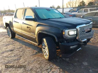 2018 GMC Sierra 1500 Denali z VIN 3GTU2PEJ9JG382192, wystawiony jako IAAI lot #41758703 z przebiegiem 96 847 mil mil oraz . Historia ofert i sprzedaży dostępna na DreamBid. Obrazek 1.