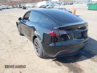 2025 Tesla Model Y Long Range with VIN 7SAYGDEEXSF267888, listed as a IAAI auction lot 41807129 with 3,002 mi miles and . Bid and sale history available at DreamBid. Image 3.