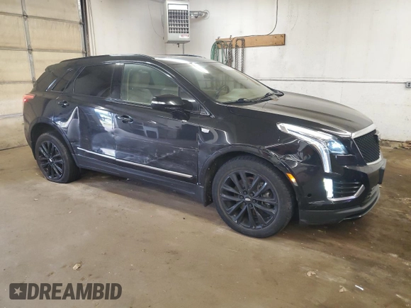 2021 Cadillac XT5 AWD Sport with VIN 1GYKNHRS1MZ103033, listed as a Copart auction lot 58586425 with 65,229 mi miles and Salvage title. Bid and sale history available at DreamBid. Image 4.
