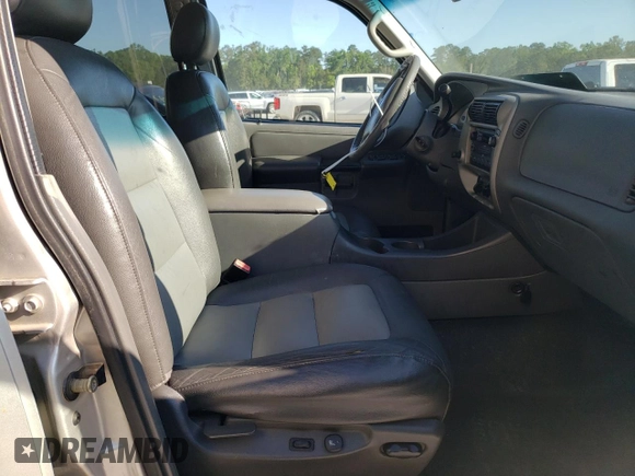 2004 Ford Explorer Sport Trac XLS with VIN 1FMZU67K24UB65144, listed as a Copart auction lot 52611305 with 211,806 mi miles and Salvage title. Bid and sale history available at DreamBid. Image 7.