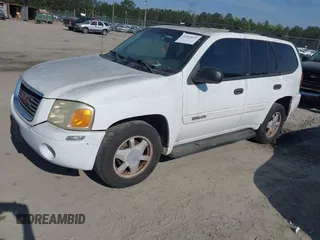 2003 GMC Envoy SLT with VIN 1GKDS13S832300090, listed as a IAAI auction lot 41993627 with 210,631 mi miles. Bid and sale history available at carsss.com. Image 2.