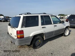 1996 Jeep Grand Cherokee Laredo z VIN 1J4EX58S3TC144191, wystawiony jako Copart lot #53153495 z przebiegiem 197 853 mil mil oraz Szkoda całkowita • Salvage title. Historia ofert i sprzedaży dostępna na DreamBid. Obrazek 3.