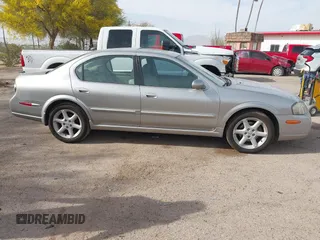 2002 Nissan Maxima GLE z VIN JN1DA31A22T302286, wystawiony jako IAAI lot #41929154 z przebiegiem 249 531 mil mil oraz . Historia ofert i sprzedaży dostępna na DreamBid. Obrazek 13.