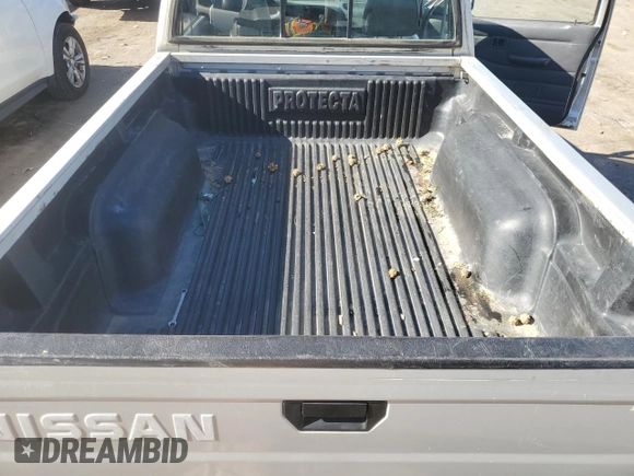 1996 Nissan Frontier XE z VIN 1N6SD11Y5TC327761, wystawiony jako Copart lot #79662594 z przebiegiem 151 631 mil mil oraz Szkoda całkowita • Salvage title. Historia ofert i sprzedaży dostępna na DreamBid. Obrazek 10.