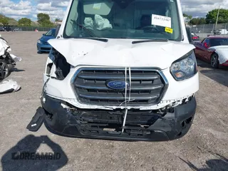 2021 Ford Transit Cargo with VIN 1FTBW3X8XMKA14051, listed as a IAAI auction lot 41672248 with 127,438 mi miles. Bid and sale history available at carsss.com. Image 6.