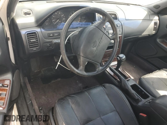 1995 Nissan Maxima GLE с VIN JN1CA21D6ST059369, выставлен на аукционе Copart как лот 74794884 с пробегом 246 806 миль миль и Списание • Salvage title. История ставок и продаж доступна на DreamBid. Изображение 8.