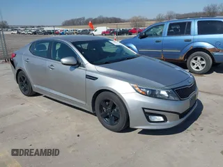 2015 Kia Optima LX with VIN 5XXGM4A78FG477630, listed as a IAAI auction lot 41771874 with 107,065 mi miles and . Bid and sale history available at DreamBid. Image 1.