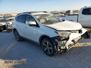 2018 Toyota RAV4 XLE with VIN JTMWFREV7JJ742974, listed as a Copart auction lot 41957735 with 87,005 mi miles and Salvage Title. Bid and sale history available at DreamBid. Image 4.