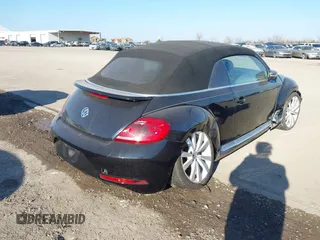 2014 Volkswagen Beetle 1.8T with VIN 3VW517AT4EM815243, listed as a IAAI auction lot 41245346 with 119,259 mi miles and . Bid and sale history available at DreamBid. Image 4.