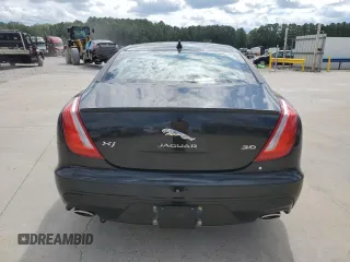 2018 Jaguar XJ with VIN SAJWA1C76J8W14271, listed as a Copart auction lot 73777914 with 124,155 mi miles and Salvage Title. Bid and sale history available at carsss.com. Image 6.