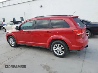 2013 Dodge Journey SXT with VIN 3C4PDDBG1DT593302, listed as a Copart auction lot 44517955 with 176,136 mi miles and Salvage title. Bid and sale history available at DreamBid. Image 2.