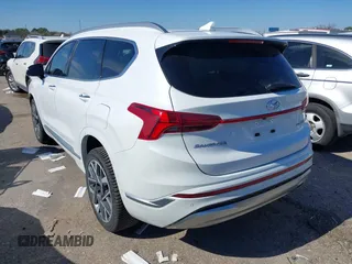 2021 Hyundai Santa Fe Calligraphy with VIN 5NMS5DAL1MH360376, listed as a IAAI auction lot 41395282 with 50,275 mi miles and . Bid and sale history available at DreamBid. Image 3.