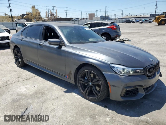 2018 BMW 7 Series 740i with VIN WBA7E2C59JG742809, listed as a Copart auction lot 66995934 with 62,017 mi miles and Salvage Title. Bid and sale history available at carsss.com. Image 4.