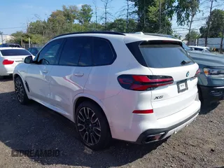 2024 BMW X5 xDrive40i with VIN 5UX23EU04R9S36715, listed as a IAAI auction lot 40168432 with 18,076 mi miles. Bid and sale history available at carsss.com. Image 3.