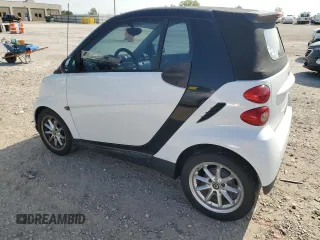 2009 Smart fortwo Passion z VIN WMEEK31X29K274073, wystawiony jako Copart lot #66758044 z przebiegiem 128 564 mil mil oraz Szkoda całkowita • Salvage title. Historia ofert i sprzedaży dostępna na DreamBid. Obrazek 2.